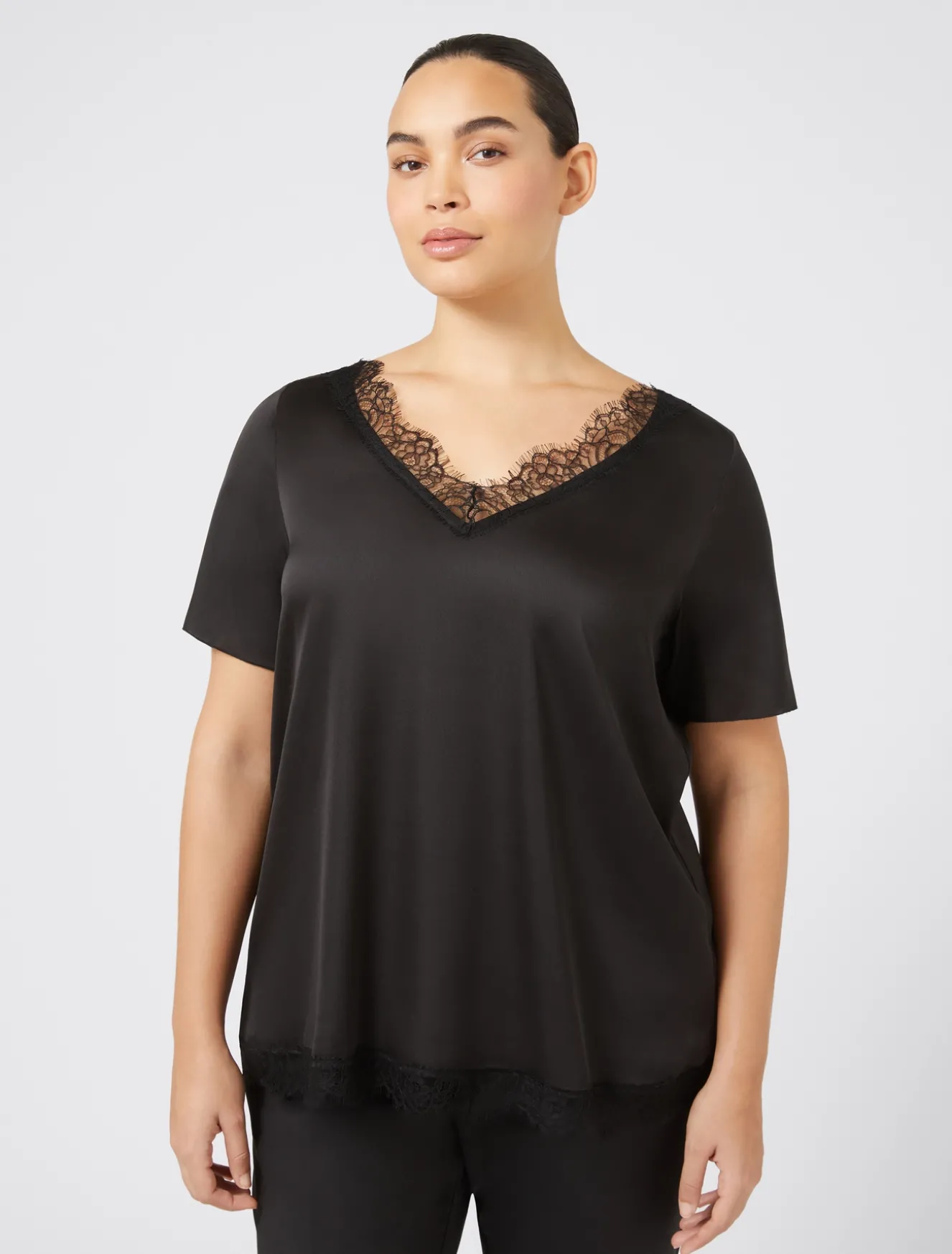 Blusa con dettagli in pizzo